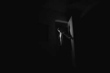 portrait of a man in the dark. black and white portrait