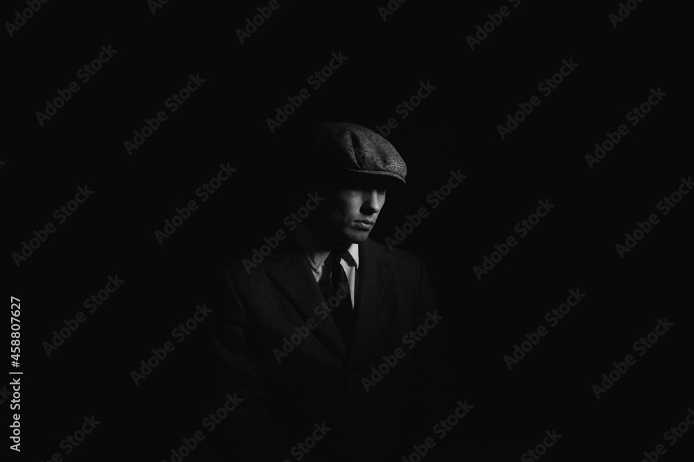 Wall mural portrait of a man in the dark. black and white portrait