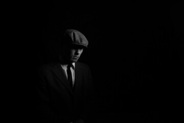 portrait of a man in the dark. black and white portrait