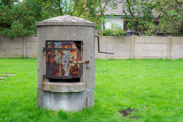 manual backyard well on the background of the lawn