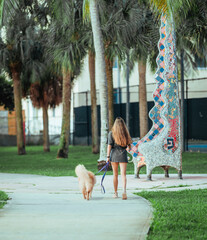 Fototapeta na wymiar woman with dog park Miami Florida outdoors 