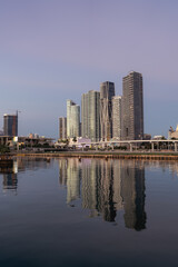 Fototapeta na wymiar downtown Miami Florida skyline skyscrapers morning sunrise reflections water travel 