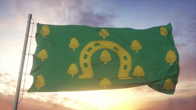 Rutland flag, England, waving in the wind, sky and sun background