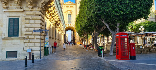 Fototapeta na wymiar Old Theatre Street located between the grandmaster's palace and republic square in the City of Valletta, Malta. 