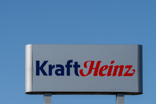 Mount-Royal, Montreal, QC, Canada - September 4, 2021: Kraft Heinz sign with blue sky in background at their plant in Montreal, QC, Canada. Kraft Heinz is an American food company. 