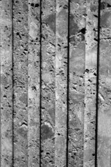 evocative black and white  image of texture of ancient dark marble wall