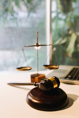 Business and lawyers discussing contract papers with brass scale on desk in office. Law, legal services, advice, justice and law concept picture with film grain effect