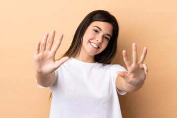 Teenager Brazilian girl over isolated background counting nine with fingers