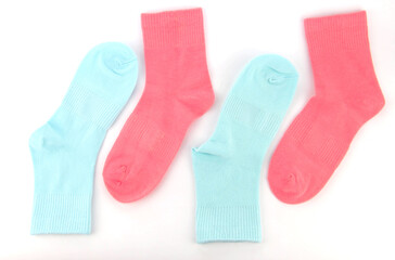 New socks on a white background. Colorful socks with beige label for your design. Isolated object
