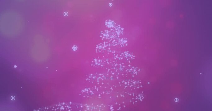 Animation of snow falling over glowing christmas tree