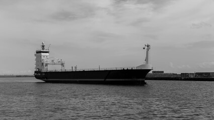 a cargo ship entering the port in the Gdańsk shipyard