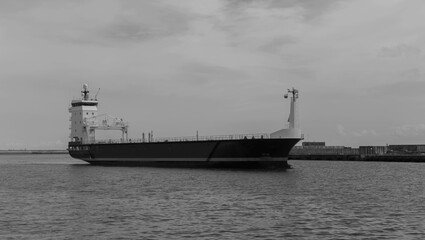 a cargo ship entering the port in the Gdańsk shipyard