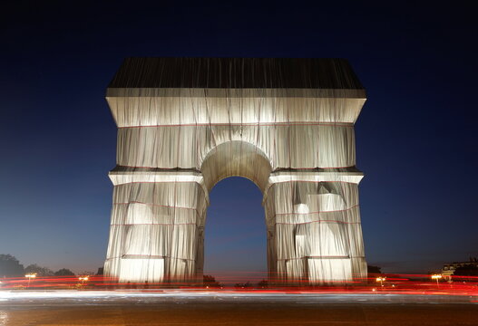 The Arc de Triomphe enveloped by a shimmering wrapper in a posthumous installation by artist Christo