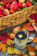 Cup of tea autumn still life with apples and leaves