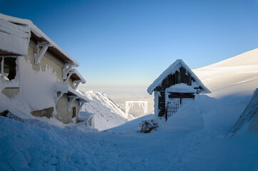 snow covered house in the mountains