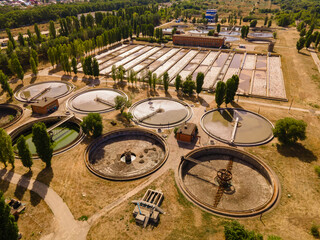 Sewage treatment plant. Sedimentation round basin or clarifier in modern sewage or wastewater...