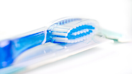 Toothbrush in a package on a white background