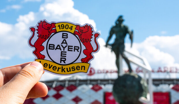 June 14, 2021, Leverkusen, Germany. The emblem of the Bayer 04 Leverkusen football club against the background of a modern stadium.