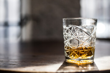 Whisky glass on a wooden surface