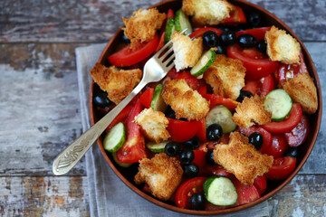 Delicious panzanella salad with olives and tomatoes. Healthy food. Italian food.