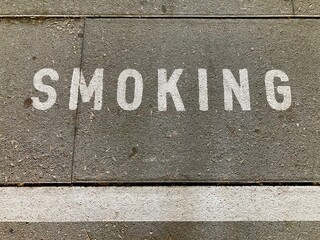 Smoking inscription on asphalt