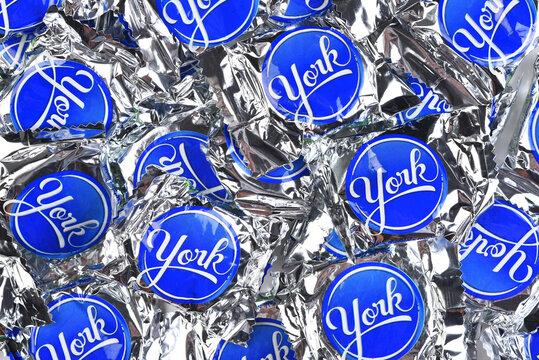 IRVINE, CALIFORNIA - 23 SEPT 2021: A large pile of  York Peppermint Patties Fun Size Candy Bars for Halloween.