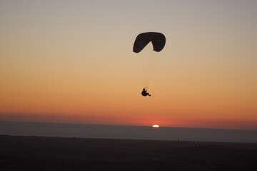 Parachute flight in the sunset