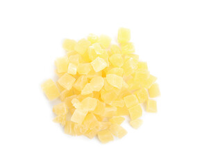 Delicious yellow candied fruit pieces on white background, top view