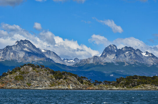 Landscape with Rocky Island and Tierra del Fuego Mountains in Drake Passage of Argentina