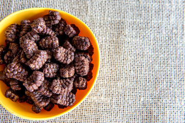Bowl of Cornflakes on the breakfast table.