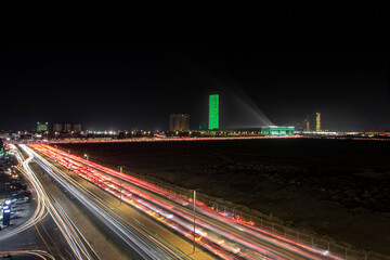Fototapeta na wymiar Jeddah, Saudi Arabia, September 2021. Busy Kings road on the special night of Saudi Arabian national day 2021