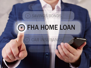  FHA HOME LOAN Federal Housing Administration inscription on the screen. Close up Businessman hands holding black smart phone. FHA loan is a mortgage that is insured by the FHA 