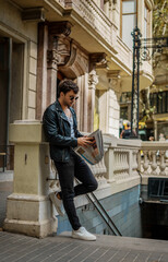 Portrait of sexy man near subway metro station entrance