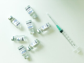 Unorganized COVID-19 vaccines and syringe