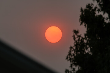 Eerie sunset in Los Angeles, California, caused by the wildfires in Central California, with...