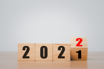 Wooden blocks with 2021 2022 number on wooden table with copy space, New year, Merry christmas.