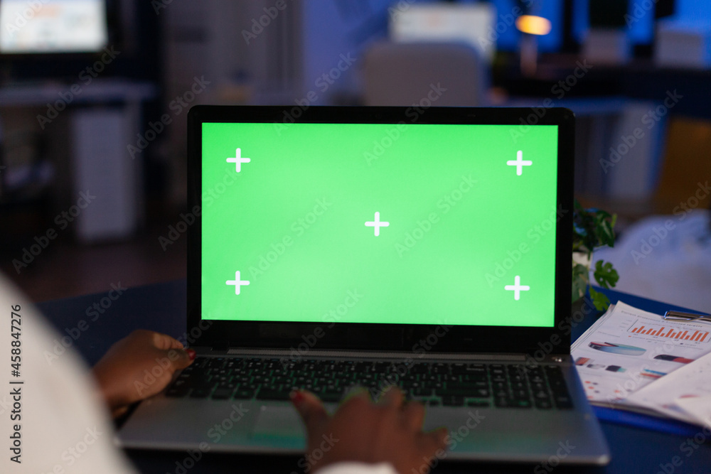 Poster mock up green screen chroma key laptop computer with isolated display standing on table in startup c