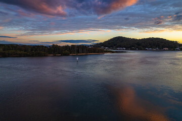 Sunrise waterscape and reflections with clouds
