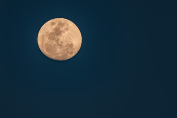 Ninety Eight Percent Full Moon in an early evening sky