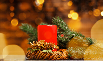Candle inside over festive blurry bokeh background. Happy New Year time. Christmas home room with tree and festive bokeh lighting, blurred holiday background. Burning candle. Beautiful Xmas decoration