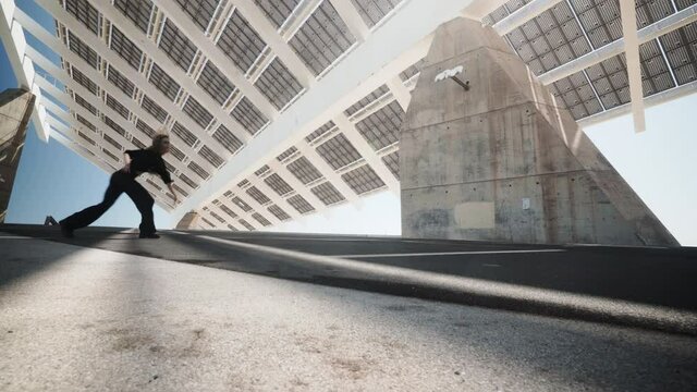 Expressive dance art form at Parc del Forum under photovoltaic pergola panels