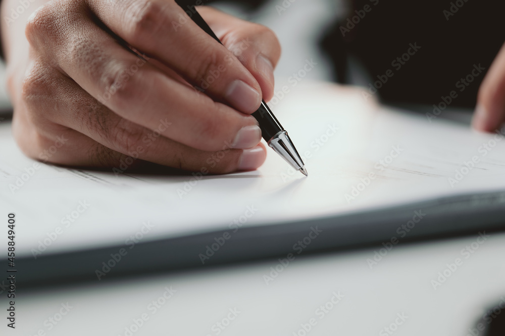 Poster signing contract. closeup businessman signing a contract investment professional document agreement 
