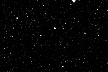 snow fall concept. Falling raindrops or snow against a black background