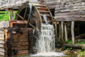 Old water mill, mill wheel on the river