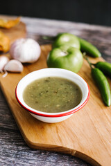 Mexican green sauce with chili peppers, green tomatoes and garlic in typical food of Mexico City