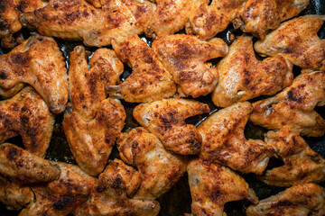 Crispy fried chicken wings on a baking sheet