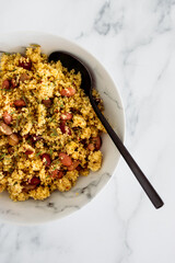 vegan couscous with mixed beans and herbs, healthy plant-based food