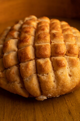 close up of a delicious traditional Mexican sweet bread on a wooden background