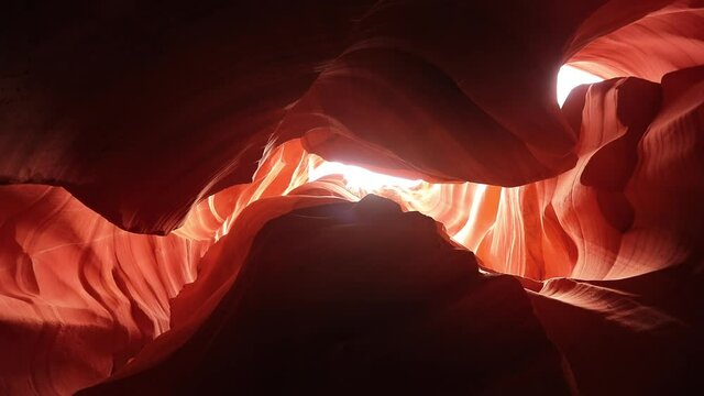 Slow motion 4K footage cinematic Antelope Canyon view from bottom up the sky. World famous landmark Lower Antelope Canyon in Arizona, most beautiful place in red desert nature, USA travel background
