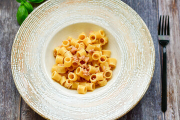  Italian home made   pasta  with  lemon  tuna  fish, parmesan cheese and black pepper .